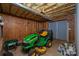 Unfinished basement with lawn mower, tools, and exposed insulation at 122 Ardmore Pl, Mooresville, NC 28117