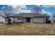 Fenced backyard with patio and mature landscaping at 125 1St N Ave, Conover, NC 28613