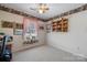 Bright bedroom with a window and built-in shelving at 125 1St N Ave, Conover, NC 28613