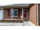 Front entrance with red door, white columns, and a welcome flag at 125 1St N Ave, Conover, NC 28613