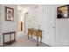 A hallway with a console table and wall art at 125 1St N Ave, Conover, NC 28613