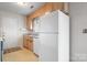 Bright kitchen features ample cabinetry and a white refrigerator at 125 1St N Ave, Conover, NC 28613