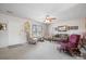 Living room with carpeting, a sofa, two armchairs, and a ceiling fan at 125 1St N Ave, Conover, NC 28613