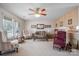 Living room with carpeting, a sofa, two armchairs, and a ceiling fan at 125 1St N Ave, Conover, NC 28613