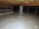 Unfinished basement with vapor barrier and dehumidifier at 130 Swift Creek Ln, Mooresville, NC 28115