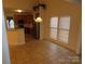 Bright dining area with tile floors and kitchen views at 130 Swift Creek Ln, Mooresville, NC 28115