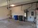 Garage interior with water heater and storage at 130 Swift Creek Ln, Mooresville, NC 28115