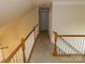 Upper hallway with carpeted floors and wooden railings at 130 Swift Creek Ln, Mooresville, NC 28115