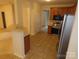 View of kitchen with stainless steel appliances and wood cabinets at 130 Swift Creek Ln, Mooresville, NC 28115