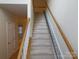 Staircase with a stairlift for accessibility at 130 Swift Creek Ln, Mooresville, NC 28115