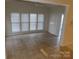 Sunroom with tile flooring and multiple windows at 130 Swift Creek Ln, Mooresville, NC 28115