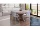 Modern dining room with round wooden table and four light-grey chairs at 1312A Reflection Pointe Blvd # 331, Belmont, NC 28012