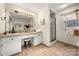 Bathroom with double vanity, shower, and large mirror at 1360 Hopewell Church Rd, Catawba, NC 28609