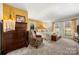 Main bedroom with king bed, yellow walls, and private access at 1360 Hopewell Church Rd, Catawba, NC 28609