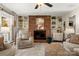 Cozy living room featuring a brick fireplace and built-in shelving at 1360 Hopewell Church Rd, Catawba, NC 28609