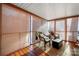 Bright sunroom featuring wicker chairs and a wooden floor at 1360 Hopewell Church Rd, Catawba, NC 28609