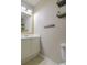 Clean bathroom with white vanity, mirror, and floating shelves at 1491 Harpers Inlet Dr, Clover, SC 29710