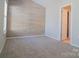 Spacious bedroom with wood-paneled accent wall and carpet flooring at 1491 Harpers Inlet Dr, Clover, SC 29710