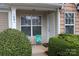 Inviting front porch with landscaping and two chairs at 1491 Harpers Inlet Dr, Clover, SC 29710