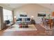 Bright and airy living room with neutral color palette and comfy seating at 1491 Harpers Inlet Dr, Clover, SC 29710