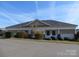 Community pool house with a brick facade and covered patio at 1491 Harpers Inlet Dr, Clover, SC 29710