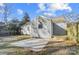 Backyard with shed, concrete patio, and wooden deck at 1715 Dunkirk Dr, Charlotte, NC 28203