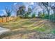 Spacious backyard with a wooden fence and grassy area at 1715 Dunkirk Dr, Charlotte, NC 28203