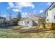 Large backyard with shed, patio, and wooden fence at 1715 Dunkirk Dr, Charlotte, NC 28203