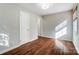 Well-lit bedroom featuring hardwood floors and ample closet space at 1715 Dunkirk Dr, Charlotte, NC 28203