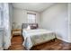 Bright bedroom with hardwood floors, a double bed, and neutral decor at 1715 Dunkirk Dr, Charlotte, NC 28203