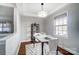 Bright dining room features a marble table and hardwood floors at 1715 Dunkirk Dr, Charlotte, NC 28203