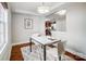 Elegant dining room with marble table and hardwood floors at 1715 Dunkirk Dr, Charlotte, NC 28203