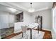 Modern dining area with marble top table and hardwood floors at 1715 Dunkirk Dr, Charlotte, NC 28203