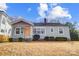 Charming gray house with orange door, landscaping, and a well-maintained lawn at 1715 Dunkirk Dr, Charlotte, NC 28203