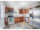 Modern kitchen with stainless steel appliances and wood cabinets at 1715 Dunkirk Dr, Charlotte, NC 28203