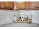 Kitchen detail showing spice rack and white subway tile at 1715 Dunkirk Dr, Charlotte, NC 28203