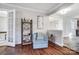 Living room with hardwood floors, a gray couch, and blue accent chair at 1715 Dunkirk Dr, Charlotte, NC 28203