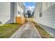 Side yard with driveway access and wooden fence at 1715 Dunkirk Dr, Charlotte, NC 28203