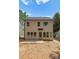 Exterior back of home featuring large windows and a door leading to the backyard at 1912 St John St, Charlotte, NC 28216