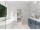 Elegant bathroom featuring a freestanding tub and double vanity at 1912 St John St, Charlotte, NC 28216