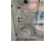 Elegant bathroom featuring a glass shower, a soaking tub, and neutral tiles at 1912 St John St, Charlotte, NC 28216
