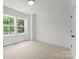 Clean, bright bedroom with ample natural light coming through two large windows at 1912 St John St, Charlotte, NC 28216