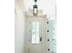 Bright foyer featuring a glass front door, modern light fixture, white trim, and neutral wall color at 1912 St John St, Charlotte, NC 28216