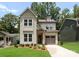 Charming two-story home boasts neutral paint, landscaped yard, and a one-car garage at 1912 St John St, Charlotte, NC 28216