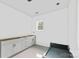 Bright kitchen with unfinished cabinets and drawers; window provides natural light at 1912 St John St, Charlotte, NC 28216