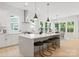 Bright, modern kitchen features a large island, pendant lights, and stainless steel hood at 1912 St John St, Charlotte, NC 28216