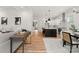 Open-concept living room with a view of the kitchen and modern design elements at 1912 St John St, Charlotte, NC 28216