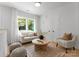 Cozy living room filled with light, comfortable seating, and stylish decor, perfect for relaxing at 1912 St John St, Charlotte, NC 28216