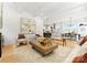 Open living space featuring a living room, dining area, and kitchen with hardwood floors at 1912 St John St, Charlotte, NC 28216