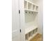 Functional mudroom featuring a built-in bench with storage cubbies and coat hooks at 1912 St John St, Charlotte, NC 28216